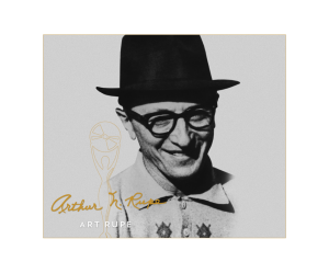 Black and white photo of a smiling man in glasses, hat, patterned shirt; gold signature and name Art Rupe in gold outline on the left.