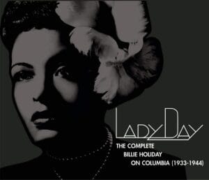 Album cover for 'The Complete Billie Holiday on Columbia (1933-1944)' features a black and white photo of Holiday with large flowers in her hair, pearl necklace.
