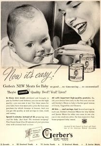 Vintage ad: Smiling woman feeds baby holding a spoon. Gerber’s meats cans (beef, veal, liver) and benefit text shown.