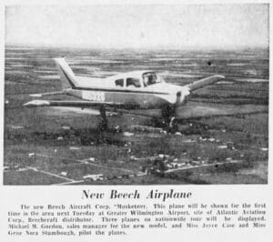 A Beechcraft Musketeer with registration N5523 on a runway, pictured in a newspaper about its display at Greater Wilmington Airport as a 'New Beech Airplane'.