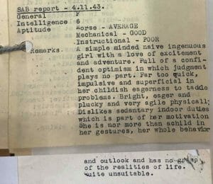 A typed report card rates a girl’s mechanical aptitude as average, her teaching ability as poor, and notes naive, impulsive behavior.