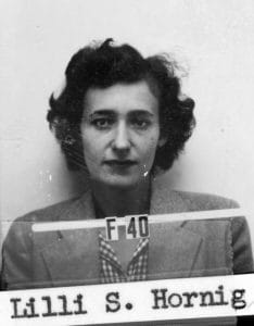 Black and white I.D. photo of a woman with short, curly hair, looking directly at the camera. Below the photo is a label reading Lilli S. Hornig and a strip marked F40 across the lower part of the image.