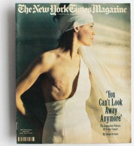 A woman in a white headscarf and dress exposes half her chest, showing a mastectomy scar, on the cover of The New York Times Magazine, August 18, 1993. The headline reads: You Can’t Look Away Anymore.