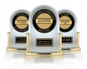 Three J.D. Power and Associates customer satisfaction awards with gold trim and black text, side by side in English, Portuguese, and Chinese.