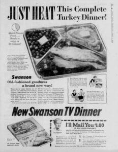 Newspaper ad for Swanson TV Dinner in 1954 showing a divided foil tray with turkey, mashed potatoes, peas, and dessert. Headline reads, Just Heat This Complete Turkey Dinner! with product packaging pictured below.